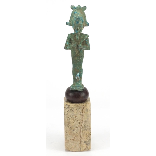2304 - Egyptian bronze figure of Osiris raised on a polished stone base, 29.5cm high