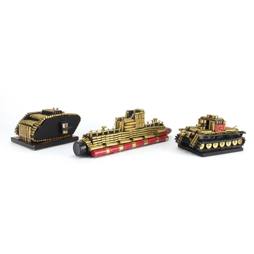 554 - Two trench art style tanks and a boat, the largest 42.5cm in length