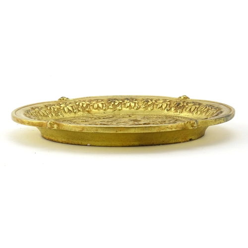 601 - Chinese gilt metal dish cast with a phoenix and dragon, 14.5cm wide