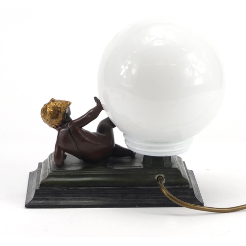 2322 - After Moreau - Bronzed putti table lamp with globular glass shade, 23.5cm high