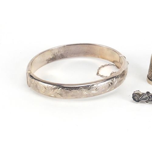 2869 - Four silver thimbles, silver bangle and Victorian silver brooch, approximate weight 36.0g