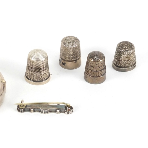 2869 - Four silver thimbles, silver bangle and Victorian silver brooch, approximate weight 36.0g