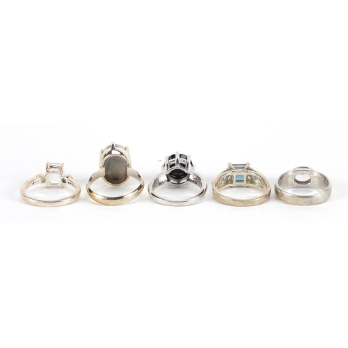 2870 - Five silver rings set with semi precious stones including white zircon, topaz, black diamond and tan... 