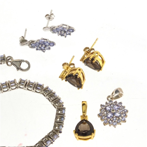 2871 - Two silver jewellery suites set with smoky quartz and purple stones, approximate weight 49.2g