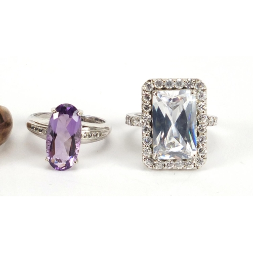 2872 - Five silver rings set with semi precious stones including amethyst, white topaz and tanzanite, some ... 