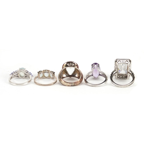 2872 - Five silver rings set with semi precious stones including amethyst, white topaz and tanzanite, some ... 