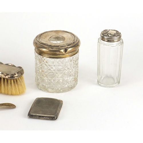 2595 - Silver vanity items including a hand mirror, cut glass tissue jar and a vesta, various hallmarks, th... 