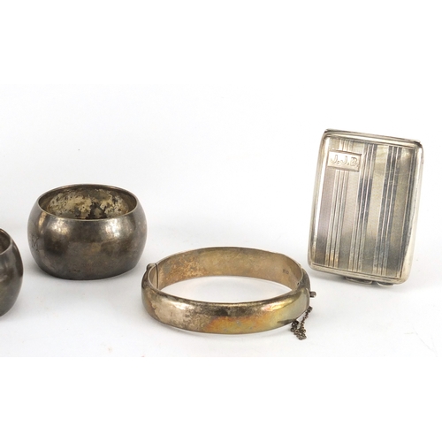 2583 - Silver items comprising shallow dish, pair of napkin rings, bangle and vesta, various hallmarks, the... 