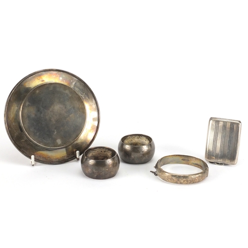 2583 - Silver items comprising shallow dish, pair of napkin rings, bangle and vesta, various hallmarks, the... 