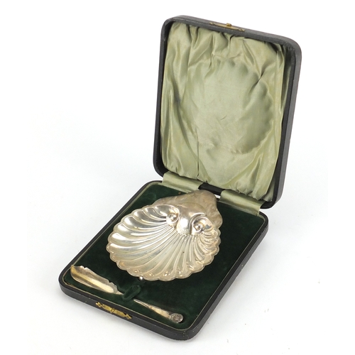 2598 - Silver shell shaped butter dish and knife, by James Deakin & Sons, Sheffield 1911, housed in a fitte... 