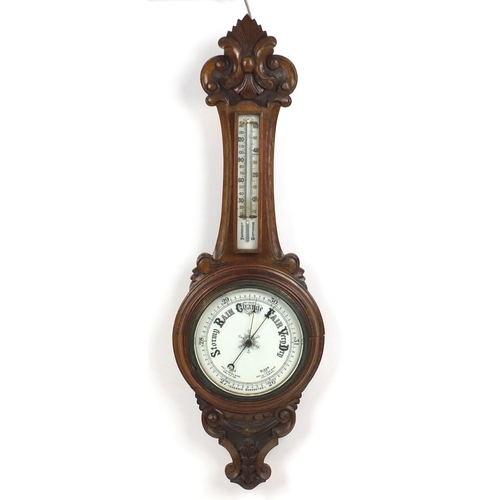 2346A - Carved oak aneroid barometer with thermometer, 90cm high
