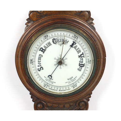 2346A - Carved oak aneroid barometer with thermometer, 90cm high