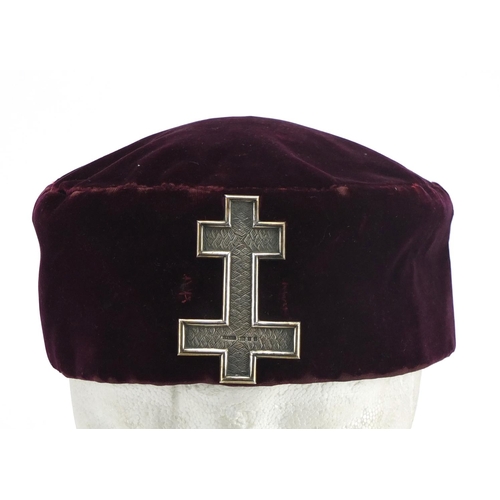 638 - Masonic interest purple cloth hat with silver badge, London hallmarked