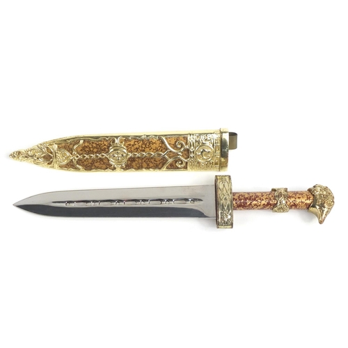 807 - Decorative dagger with eagle head handle and sheath, 27cm in length