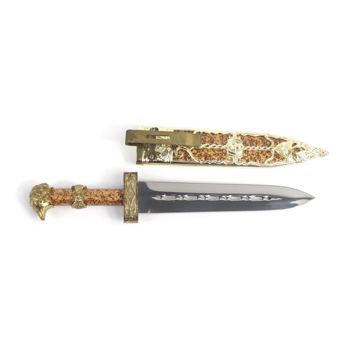 807 - Decorative dagger with eagle head handle and sheath, 27cm in length