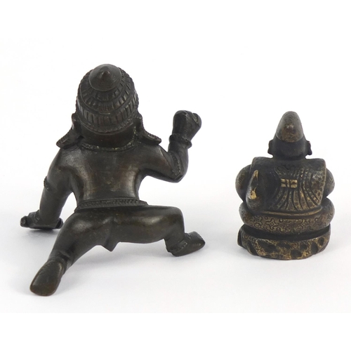 462 - Two Middle Eastern bronzed metal figures, the largest 7.5cm high