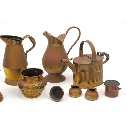 292 - Metalware including copper jugs and a watering can, the largest 57cm high