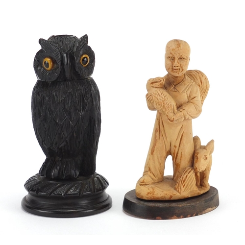 746 - Carved wooden owl and a Chinese figure of a young boy, the largest 12.5cm high