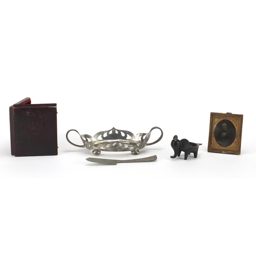 697 - Miscellaneous items including an Art Nouveau English pewter stand and a bronze elephant with registe... 