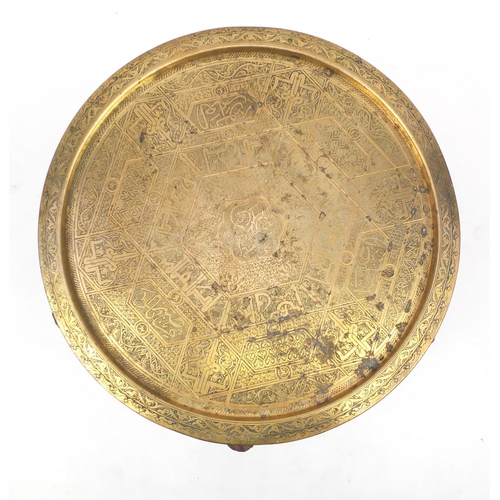 49 - Cairo ware brass tray topped folding occasional table, 53cm high x 61cm in diameter
