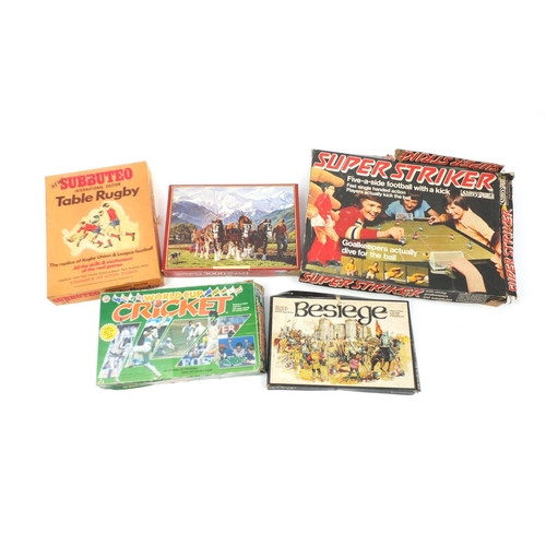 871 - Vintage games including World Cup table top cricket, Super striker and Subbuteo table rugby