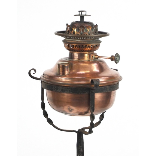 50 - Arts & Crafts telescopic wrought iron and copper standard oil lamp, 148cm high