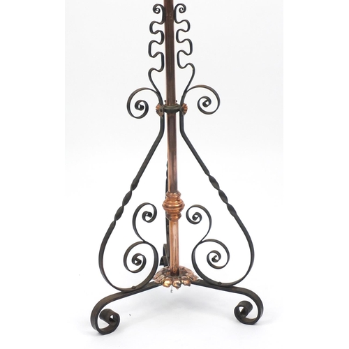 50 - Arts & Crafts telescopic wrought iron and copper standard oil lamp, 148cm high