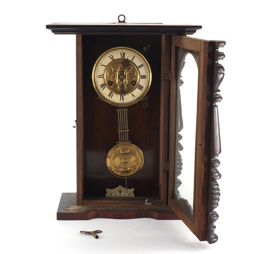 568 - Walnut cased striking wall clock, with gilt dial and visible pendulum, 48cm high