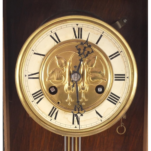 568 - Walnut cased striking wall clock, with gilt dial and visible pendulum, 48cm high