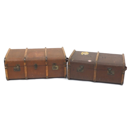 100 - Two vintage wooden bound travelling trunks, one with Hamburg-Amerika Linie shipping label, the large... 