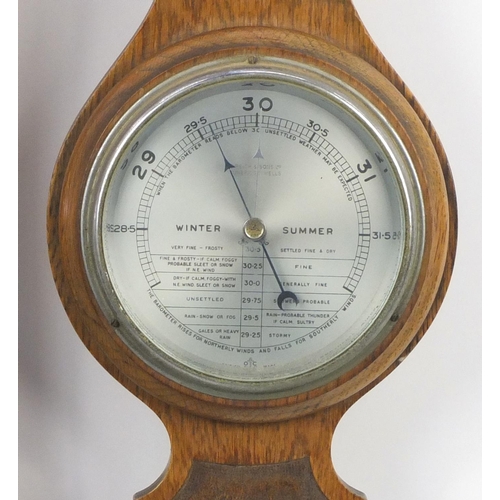 189A - Three carved oak wall hanging barometers, the largest 86cm in length