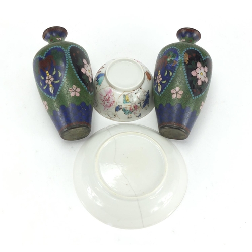 750 - Chinese porcelain tea bowl and saucer and a pair of cloisonné vases enamelled with flowers