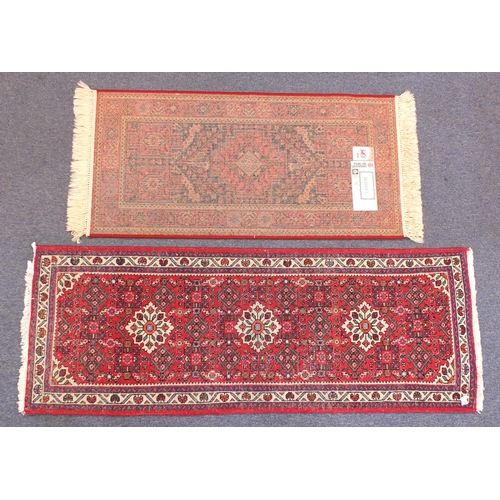 119 - Two geometric pattern carpet runners, the largest 190cm x 70cm
