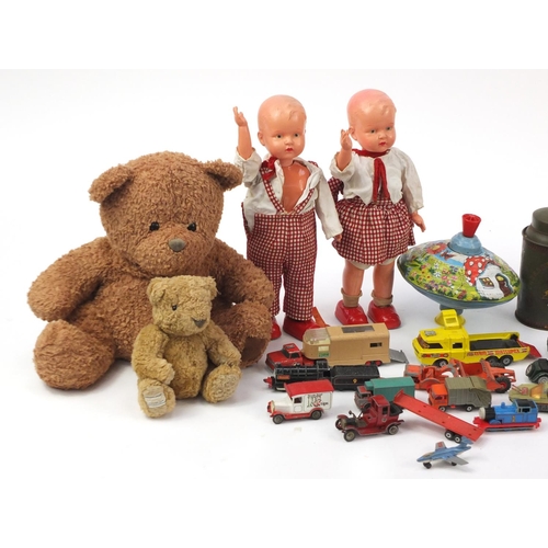 276 - Vintage and later toys including a bisque head doll, teddy bears and clock work walking dolls