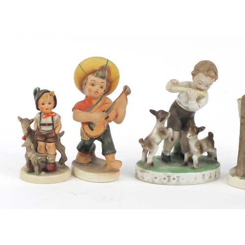 202 - Hand painted German figures of children including two Goebel, the largest 16cm high