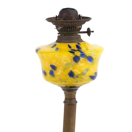 2224 - Victorian brass oil lamp with yellow marbleised glass reservoir, 66cm high