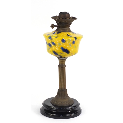 2224 - Victorian brass oil lamp with yellow marbleised glass reservoir, 66cm high