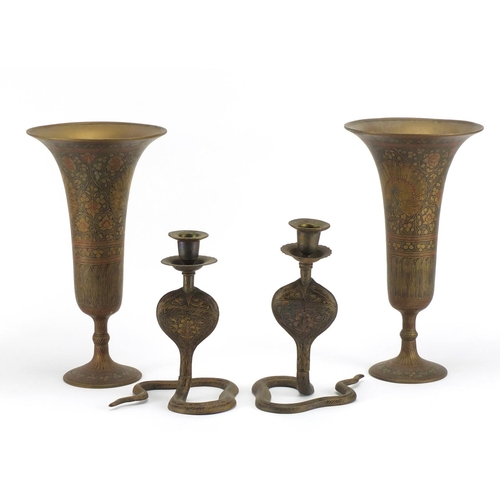 732 - Pair of Cairoware brass vases and cobra candlesticks, the vases, 26cm high