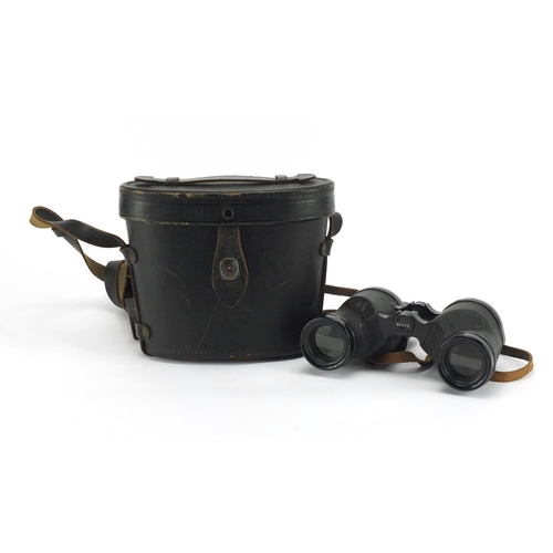1002 - Pair of Military interest binoculars inscribed US Navy Buships MKXXXIII 1943 with leather case