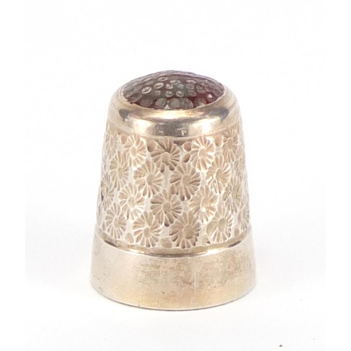 584 - Silver thimble with inset hard stone top, indistinct Birmingham hallmarks, 2.2cm high