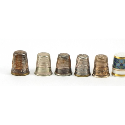 587 - Eleven white metal thimbles and one Royal Doulton
