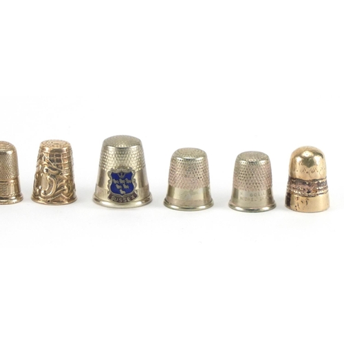 587 - Eleven white metal thimbles and one Royal Doulton