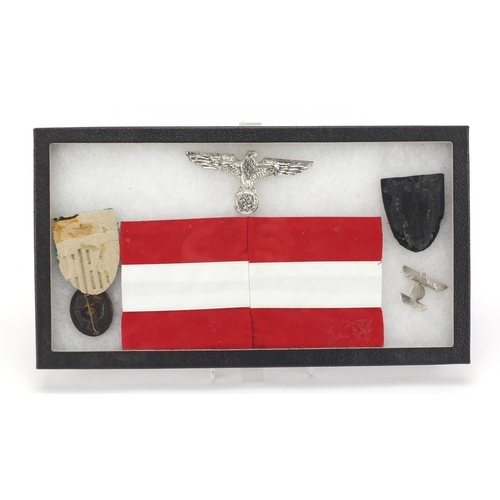 1005 - Five German style Military interest badges and an armband