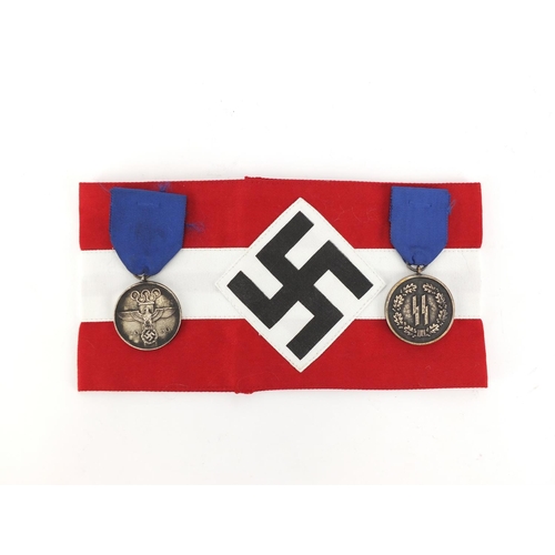 994 - Two German style Military interest medals and an armband