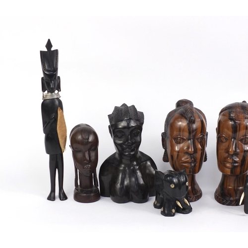 887 - African ebony and hardwood carvings including two pairs of busts, figures and elephants, the largest... 