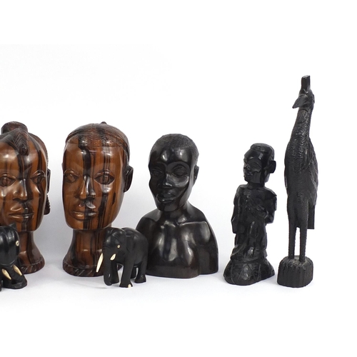 887 - African ebony and hardwood carvings including two pairs of busts, figures and elephants, the largest... 