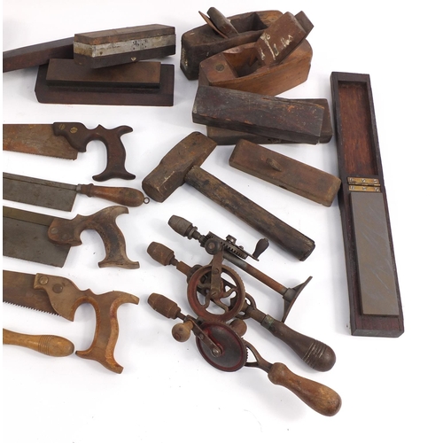 895 - Vintage hand tools including saws, drills and wood planes