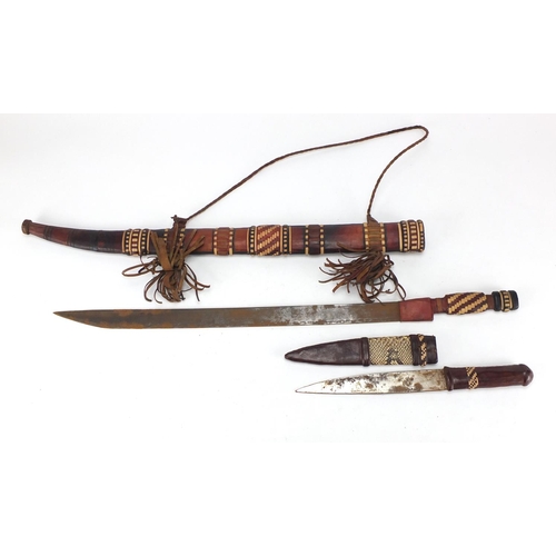 790 - African sword and dagger in scabbards and two skin pouches