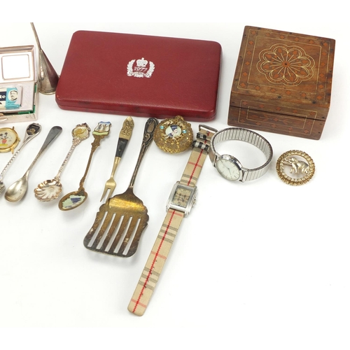 722 - Miscellaneous objects including wristwatches, matchbox cases, lighters, spoons and trinkets