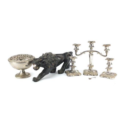197 - Silver plated three branch candelabra, pair of matching candlesticks, rose bowl and carved ebony lio... 